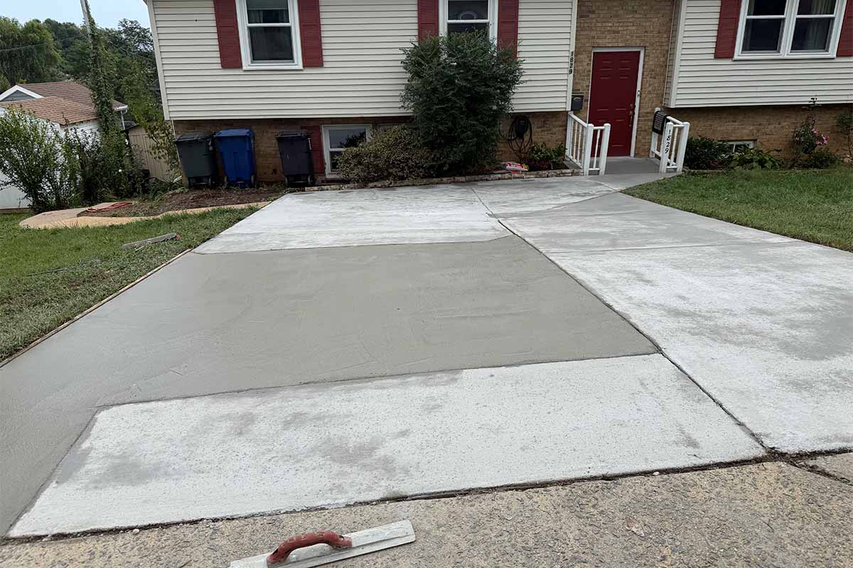Driveway repair and resurface in the parking space of a house in Arlington VA