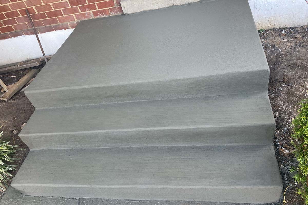 New concrete steps freshly installed in front of a DC home