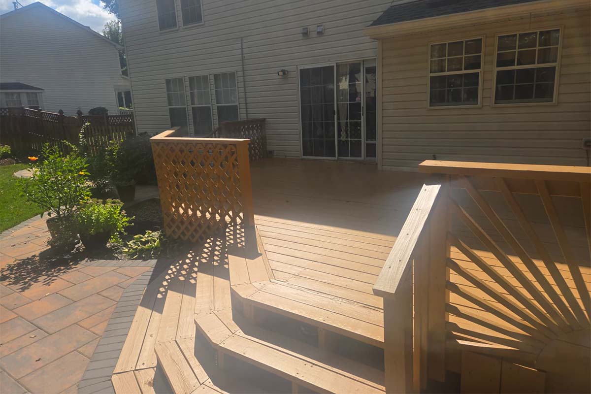 Wooden stairs of a wooden deck in Waldorf repaired and repainted